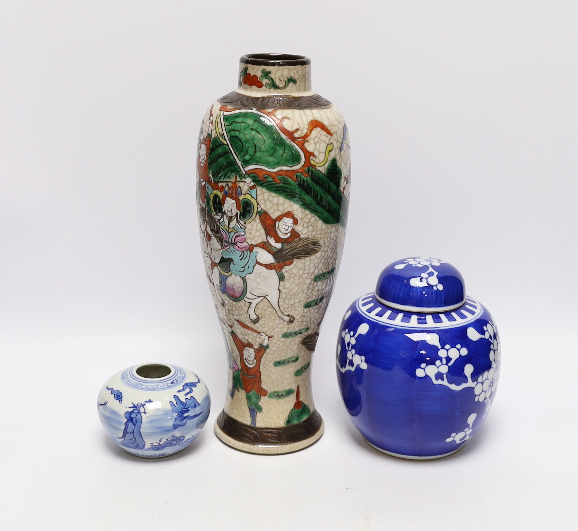 An early 20th century Chinese crackle glaze vase and two blue and white jars, largest 30cm high